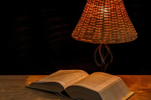 Bedside table with a lamp and book for relaxing bedtime