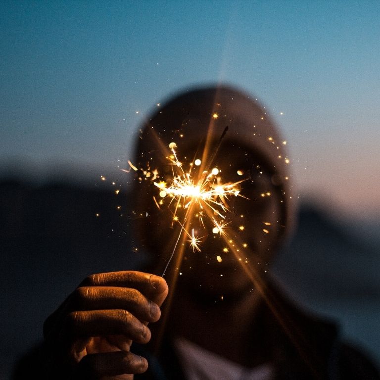 Person celebrating new year after finishing the year strong, and is now ready to face the new year stronger