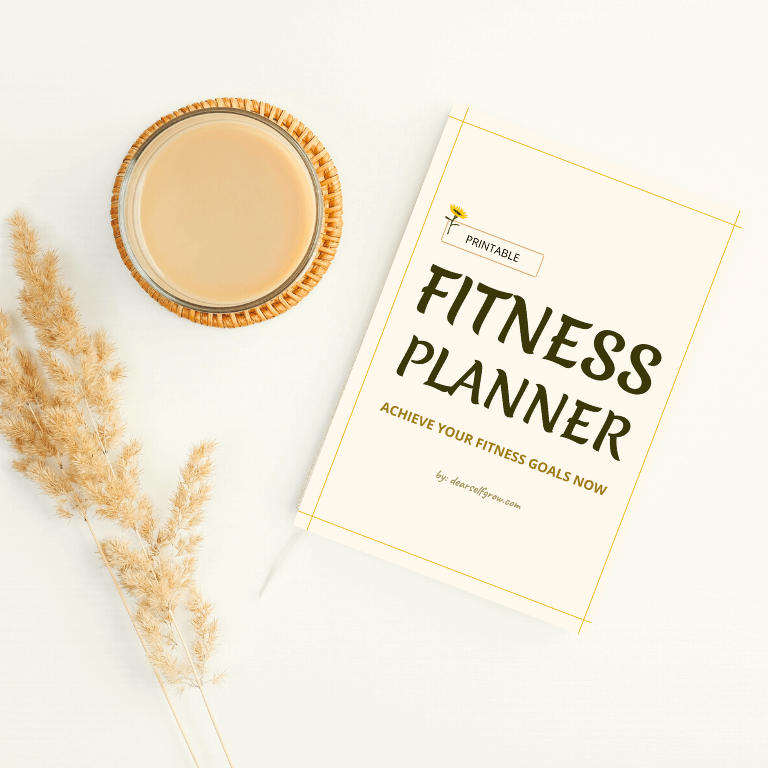 Fitness planner title page in a table with coffee and dry flowers